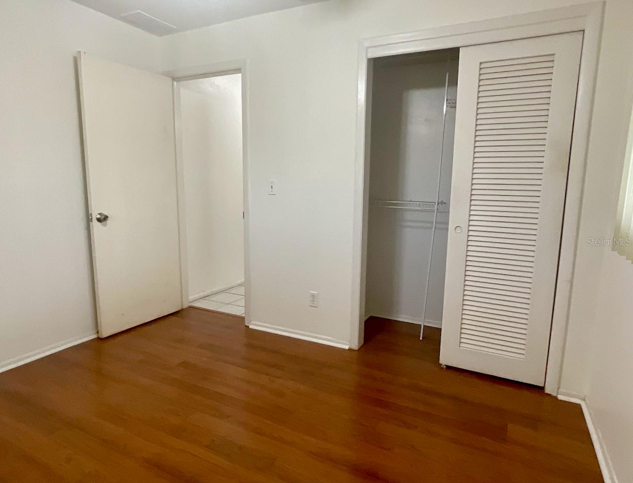 Guest bedroom closet and door to hall