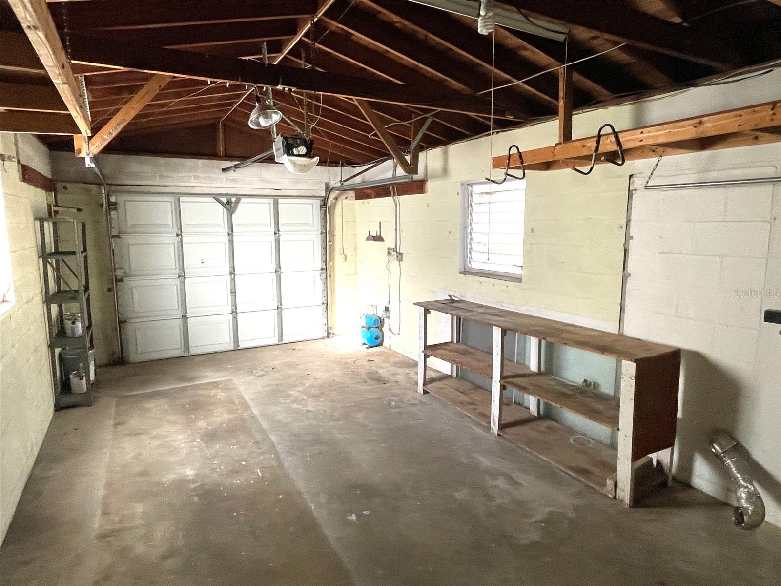 Garage w/ garage door opener is accessed from the alley.