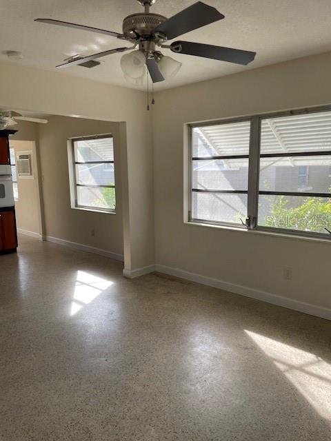 Looking from family room toward kitchen and cozy eating area by window.