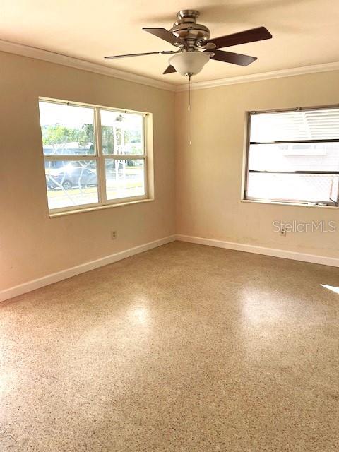 Looking from hallway into the living room. Front entry is out of sight to the left.