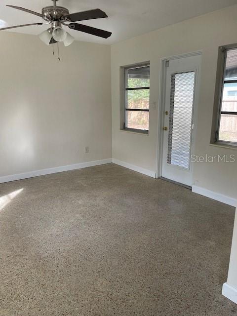 Looking from kitchen into family room, Door on right leads to roofed/screened patio.