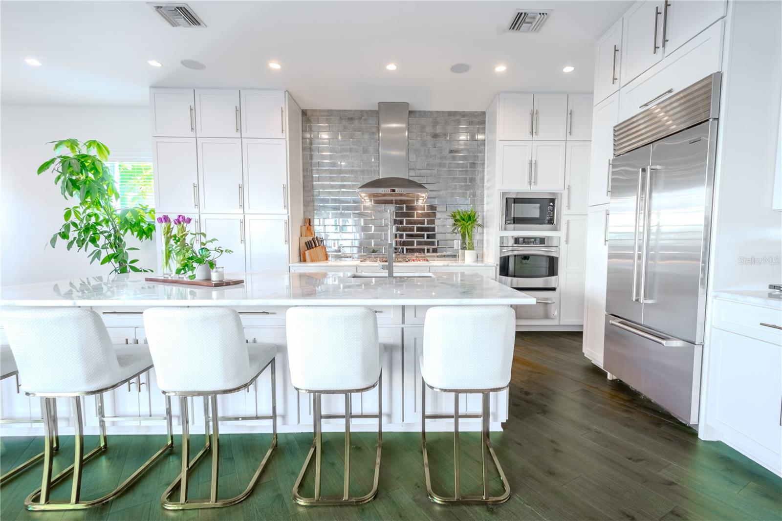 The kitchen’s centerpiece: a stunning marble island with seating for 5-6, perfect for hosting or casual meals.