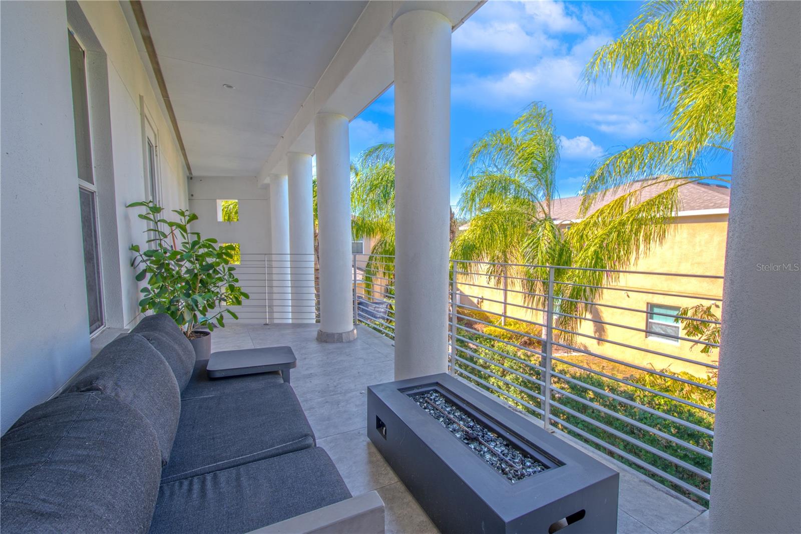 Elegant and inviting, the primary bedroom features French doors leading to a balcony, perfect for morning coffee with a view.