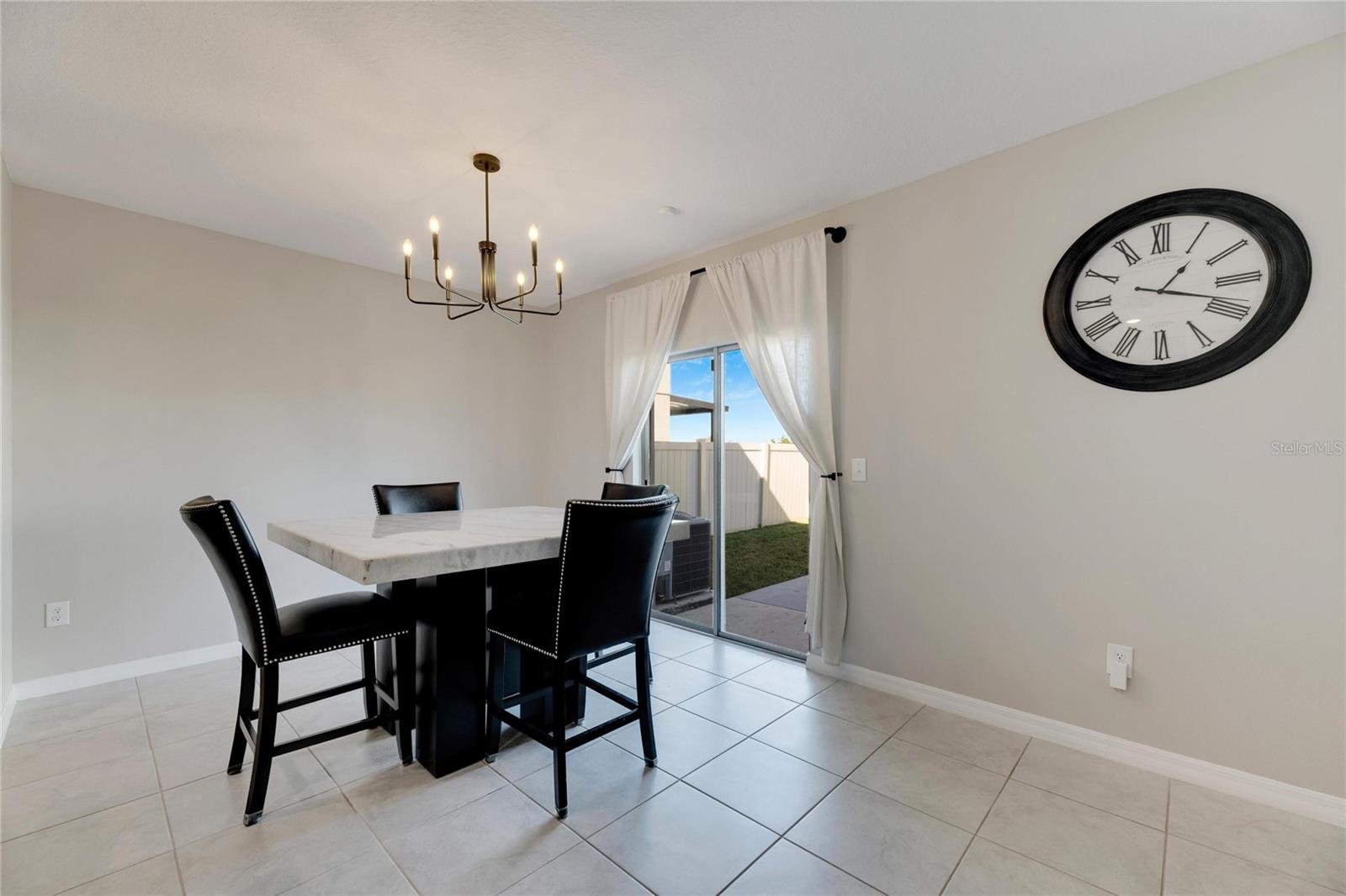 Dining Area Overlooking Fenced Rear Yard