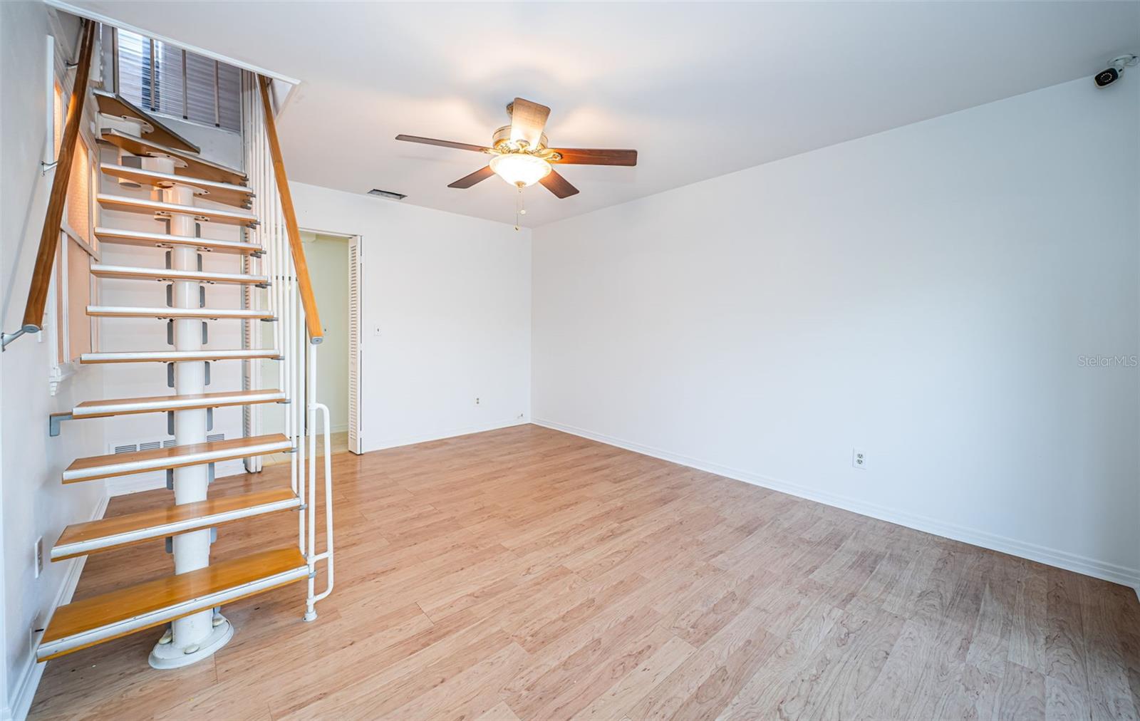 Living Room with staircase to the Upper Level Bonus Room!