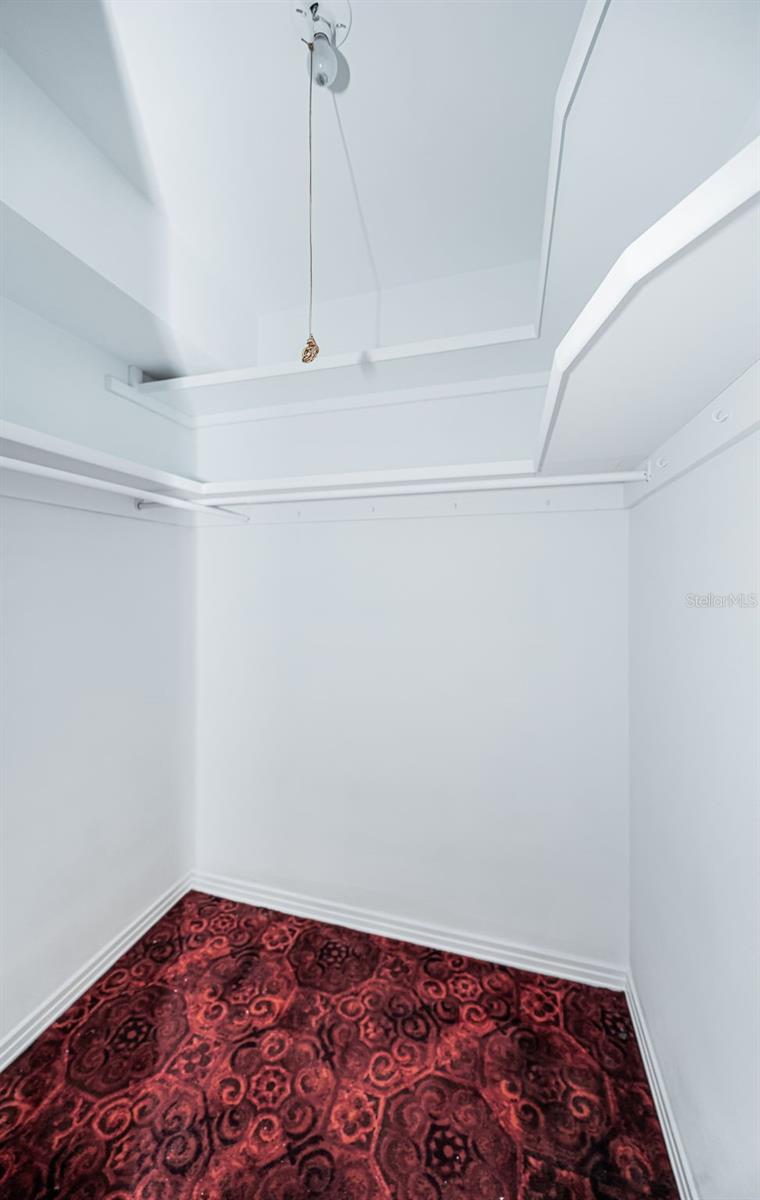 Primary bedroom walk-in closet