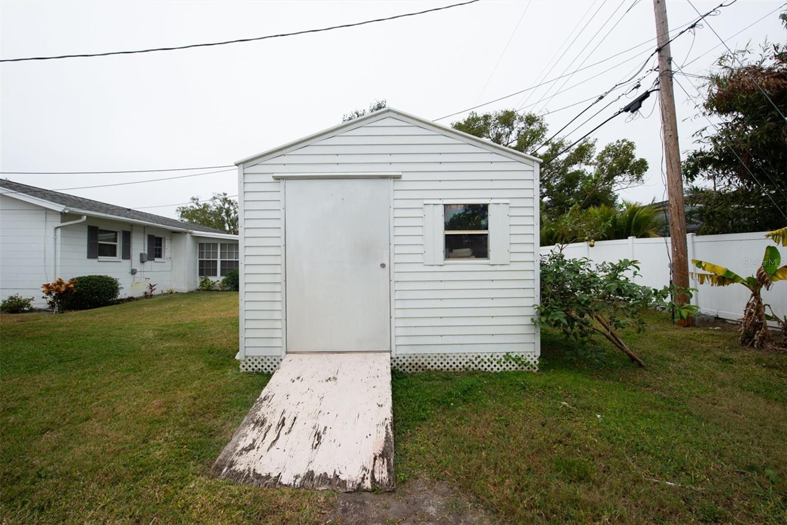 Custom built shed with AMPLE storage.