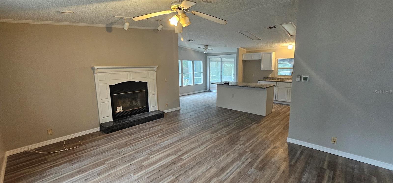 Living Room looking into kitchen and breakfast nook area