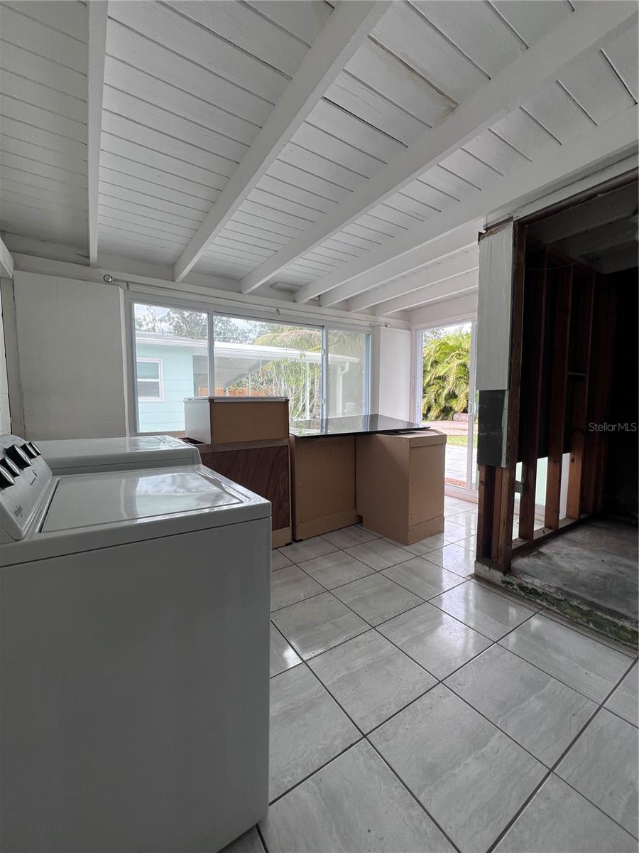 Sun Room with indoor laundry to the right