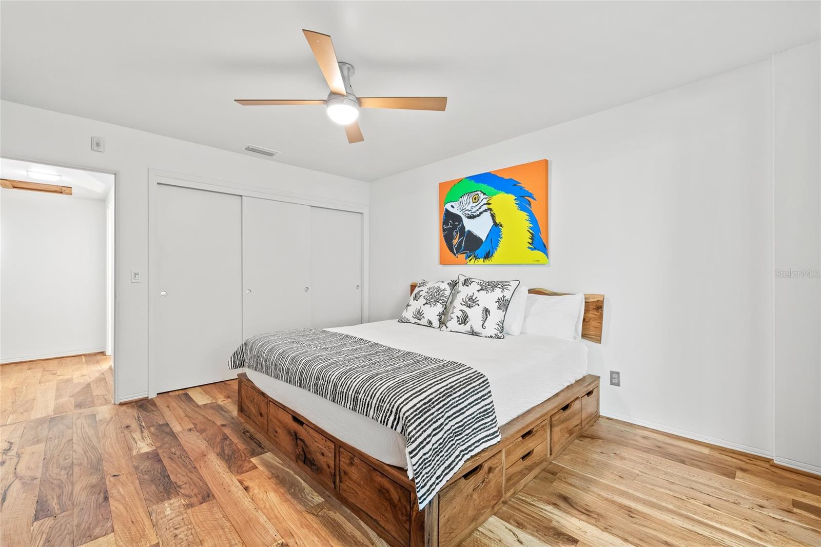 The bedroom includes a deep closet and a ceiling fan.