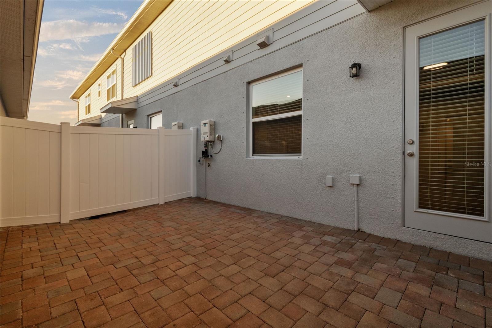 Courtyard area with pavers - the door shown goes to dining/kitchen