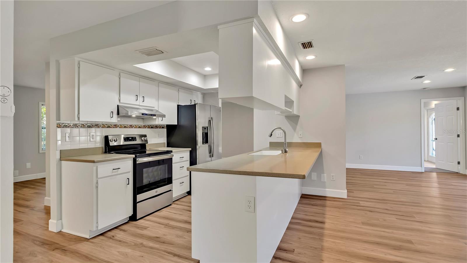 Open Kitchen (11x13) with Breakfast Bar leading to the Family Room