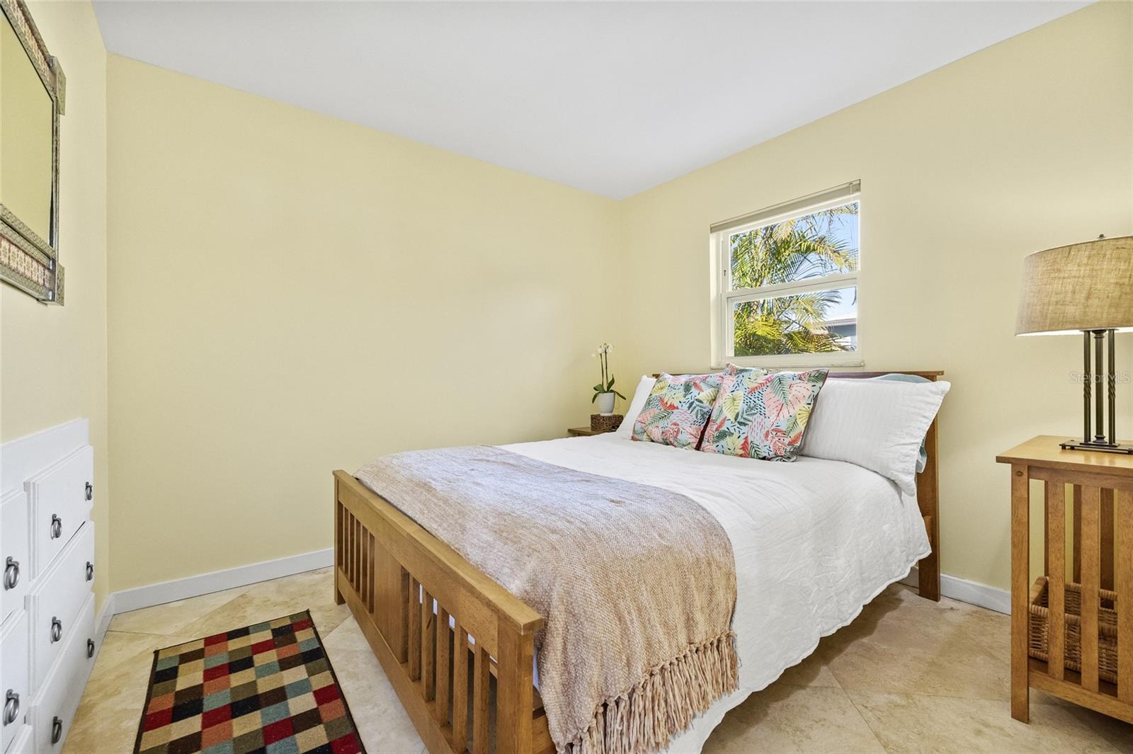 The 3rd bedroom is conveniently located next to a full bathroom for guest comfort.