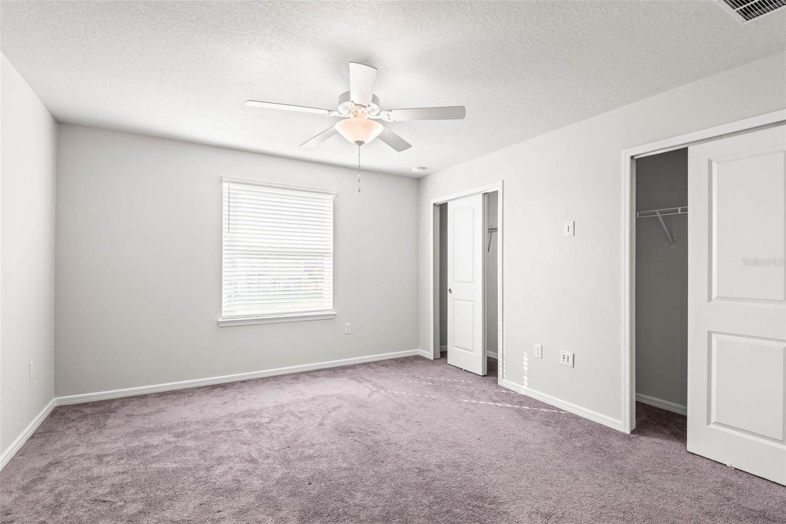 Bedroom 2 with walk-in closet & ensuite bath.