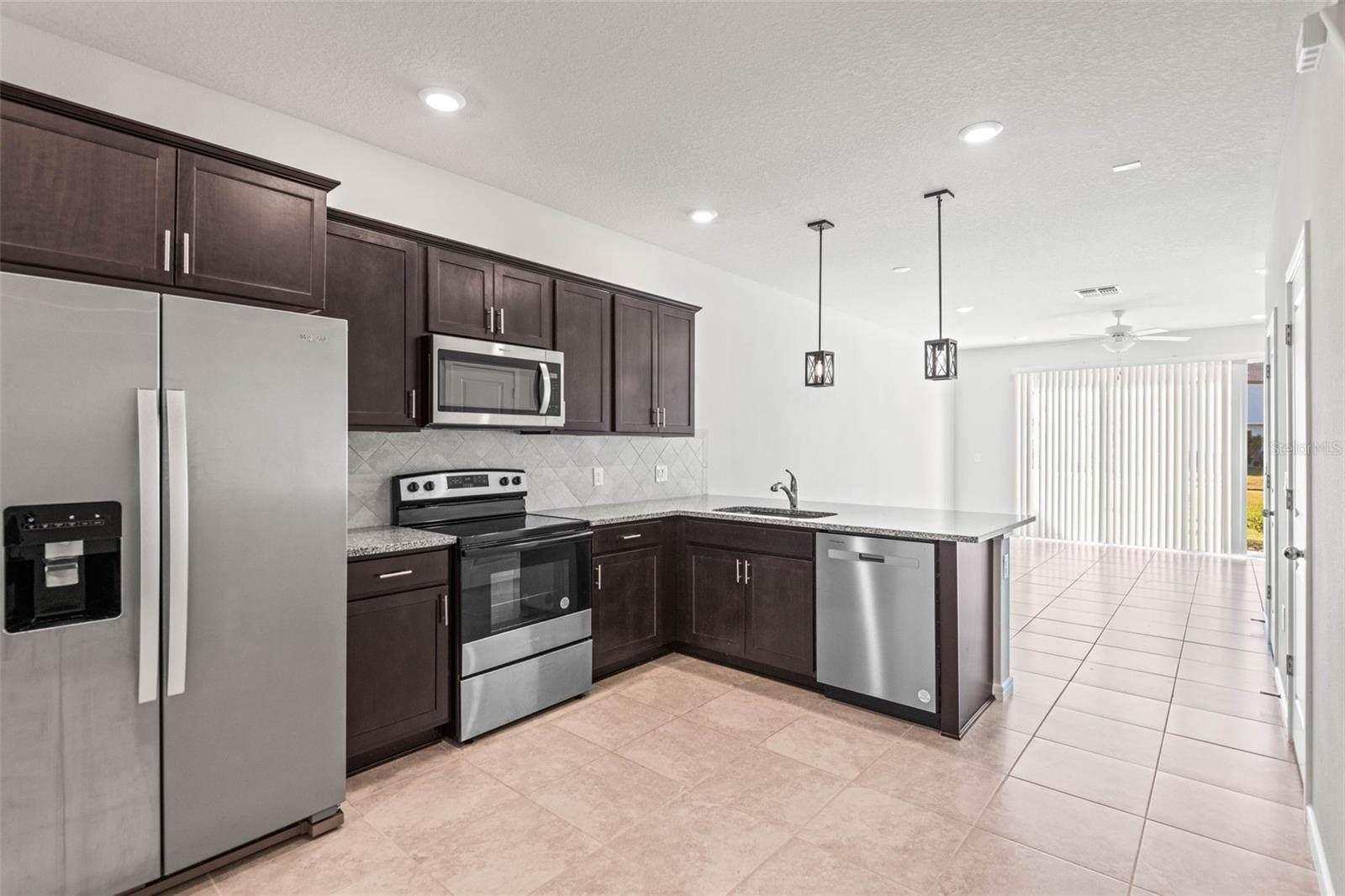 The kitchen has ample room for a floating island.