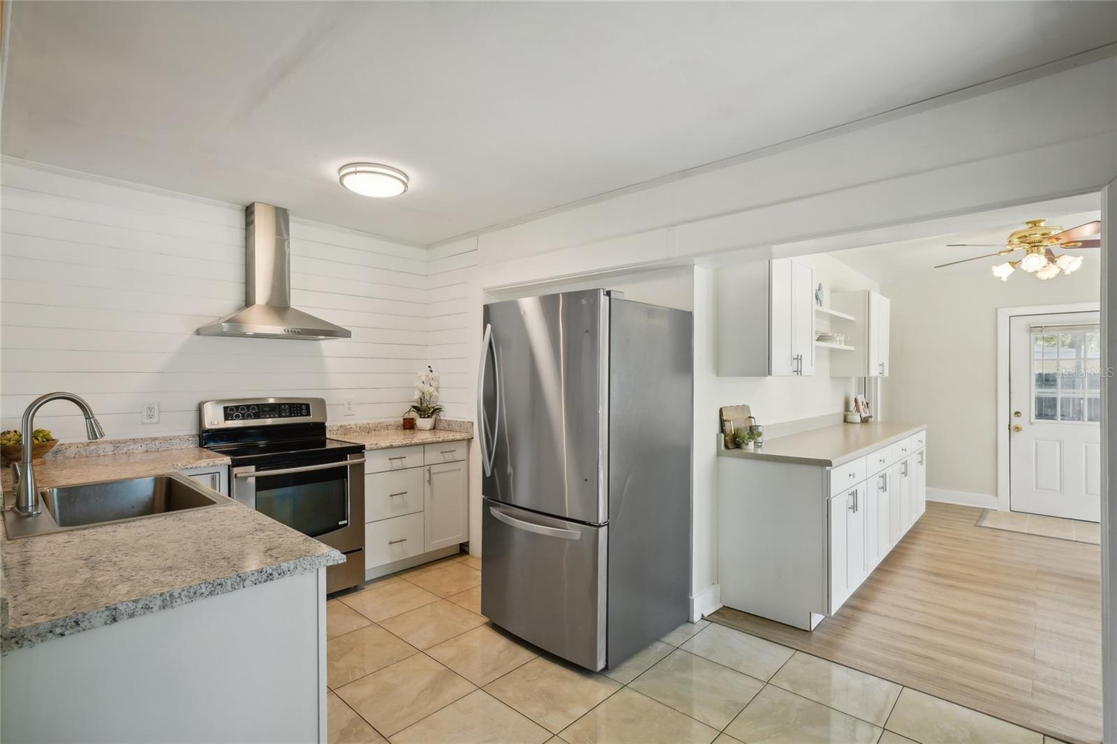 New cabinets, sink and stainless steel appliances