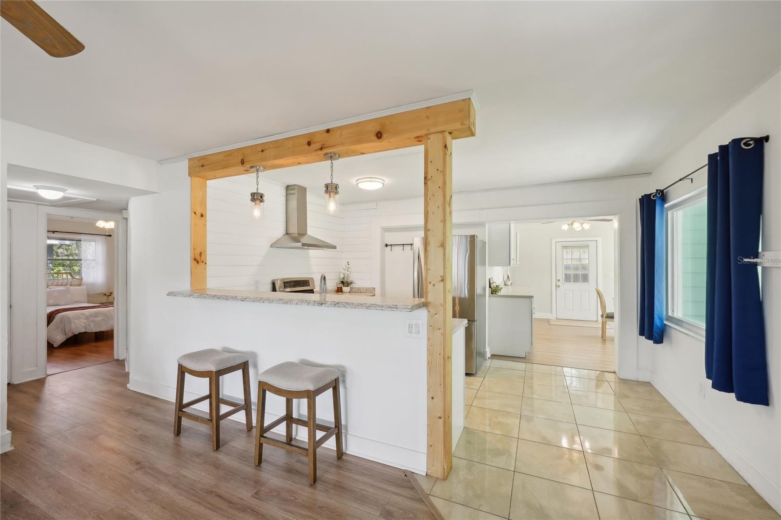 Great sightlines from updated kitchen, shiplap and wood trim accents