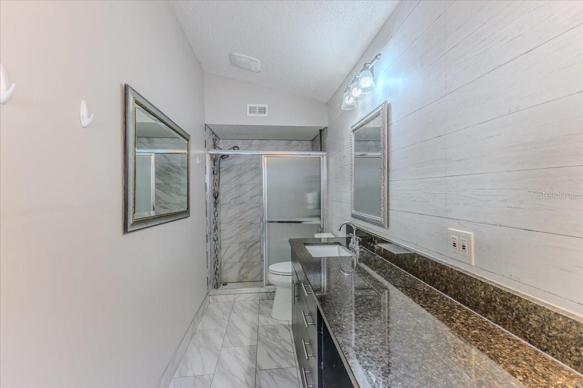 Marble Looking Floor & Walk in Shower