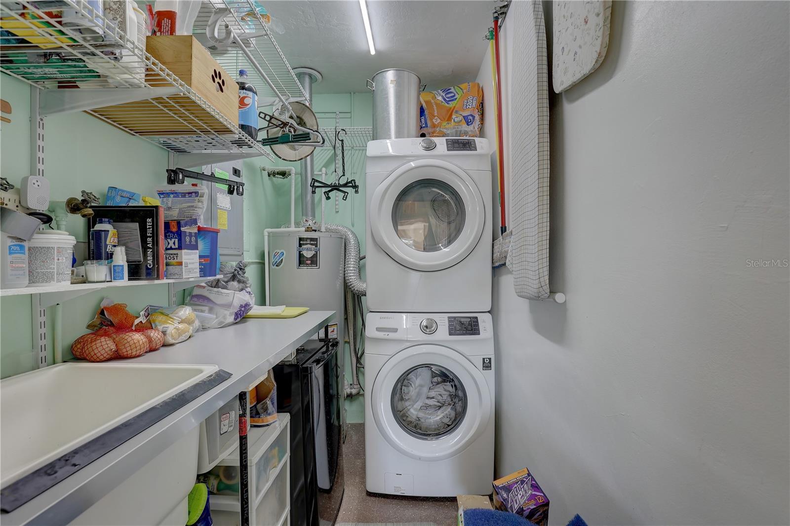 View of laundry room from kitchen hallway