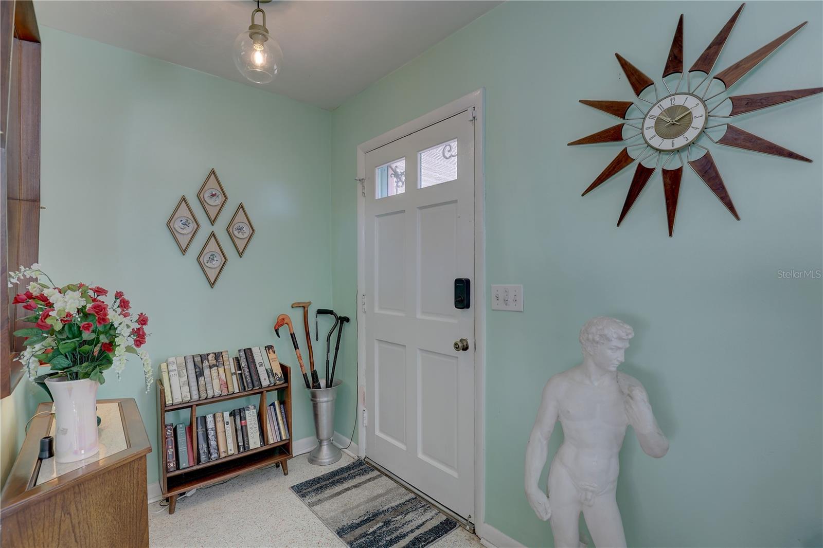 View of front door from living room