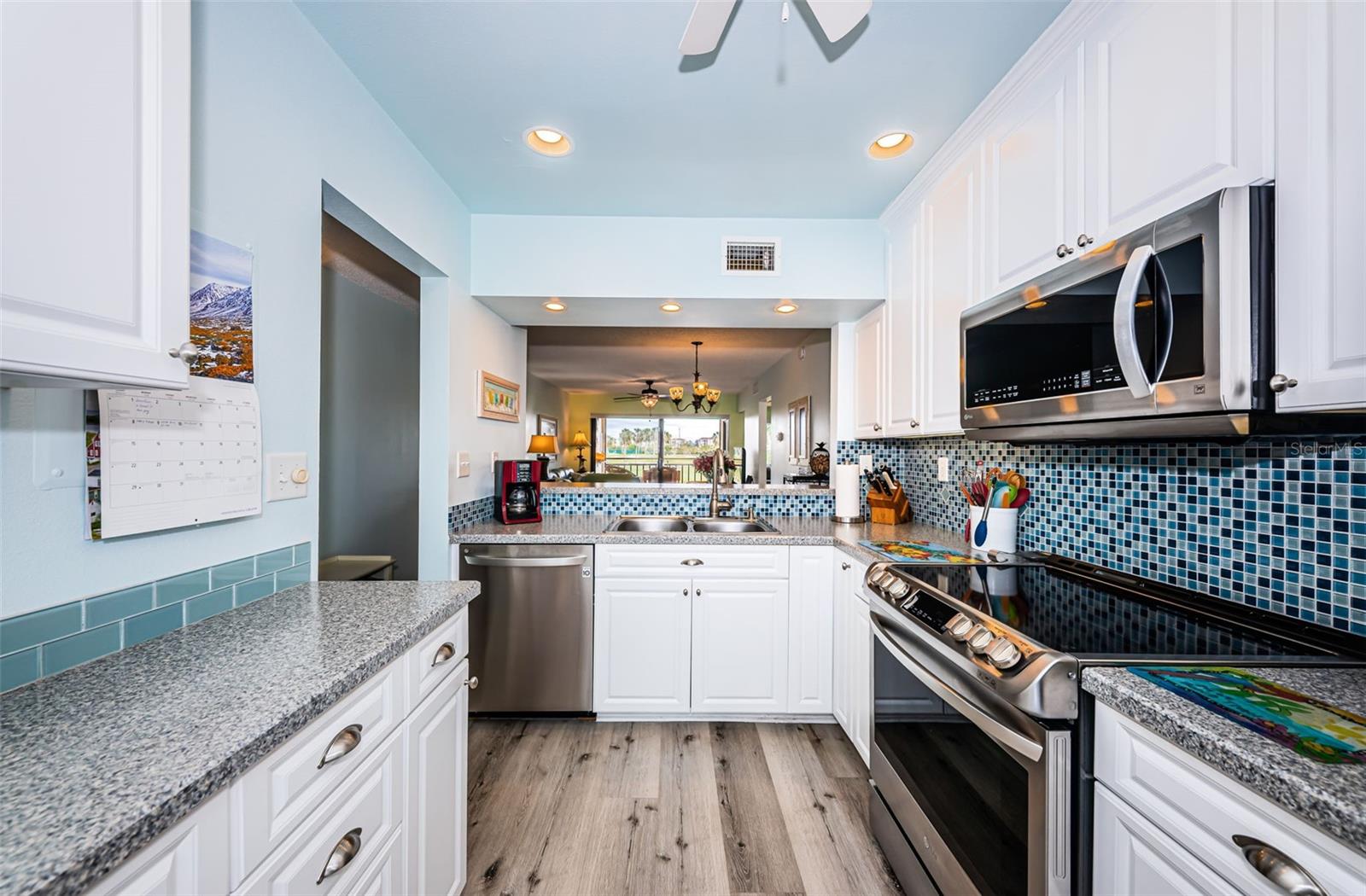 Pretty kitchen with beautiful backsplash with the colors of the sea