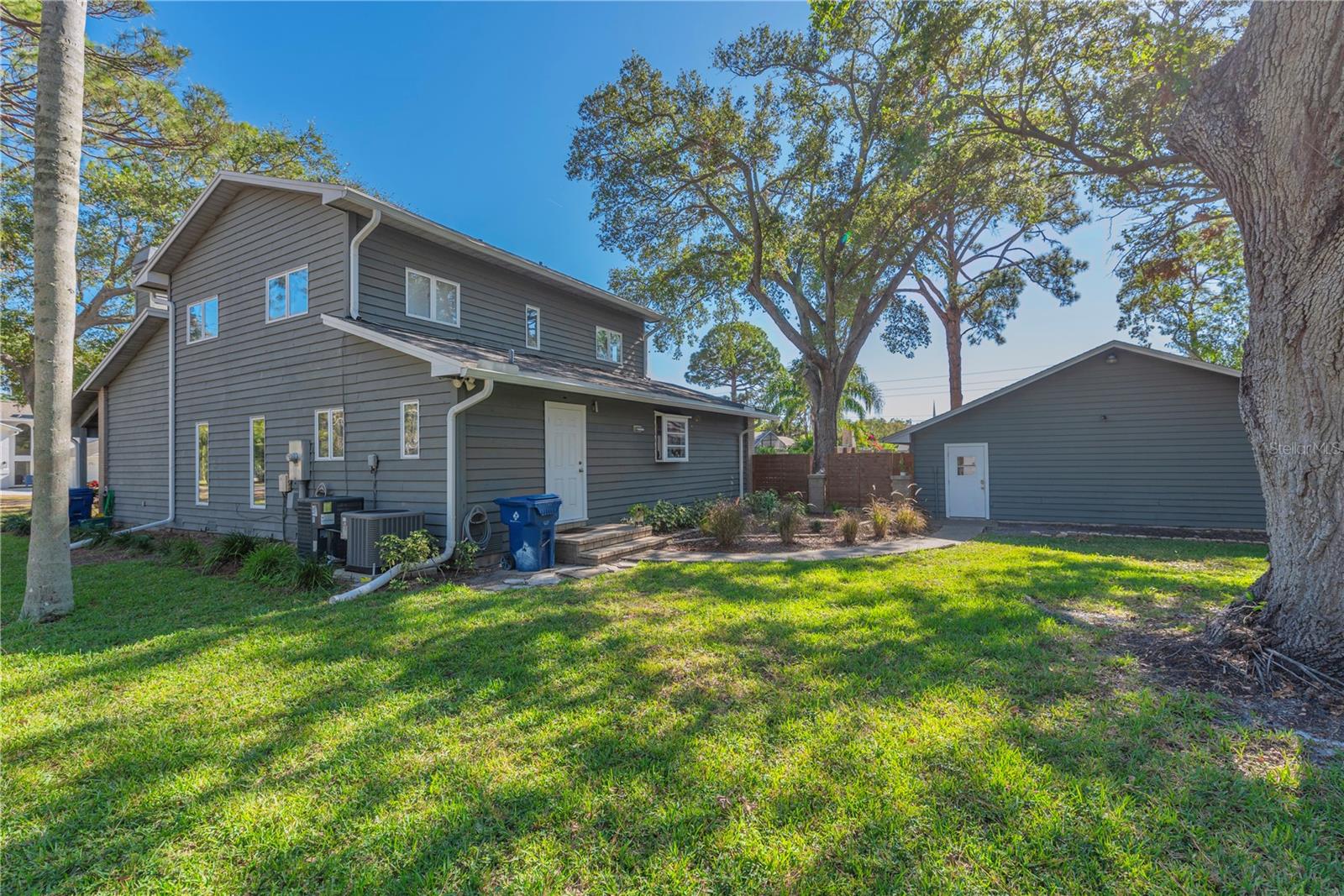 Back of home and detached garage.