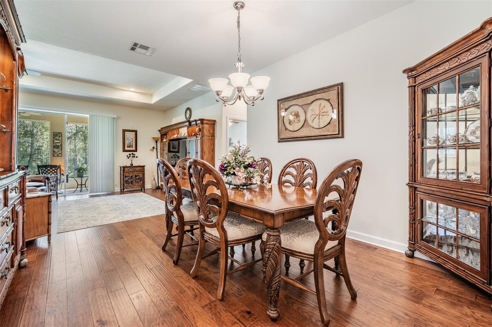 Formal dining area with view of backyard