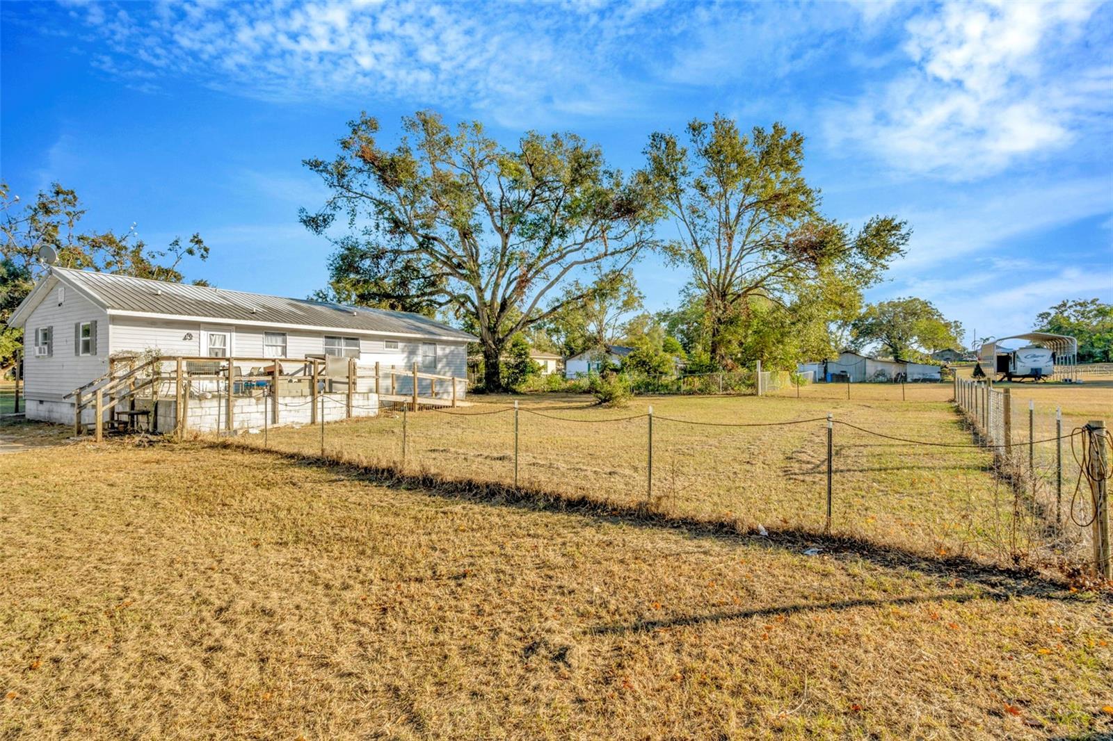 This fence is NOT the property line, it goes back to the trees