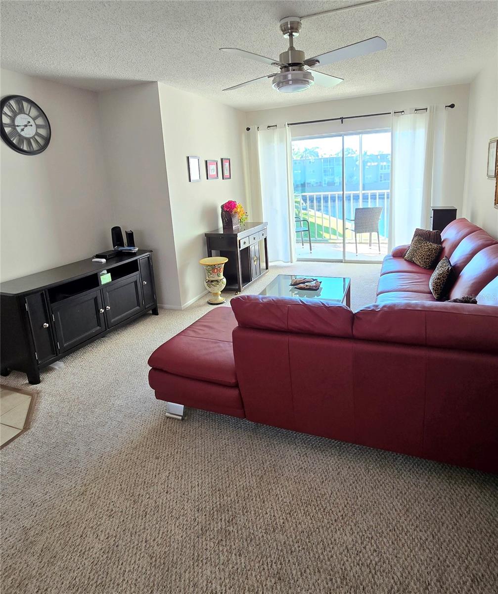 Living room also overlooks pond.