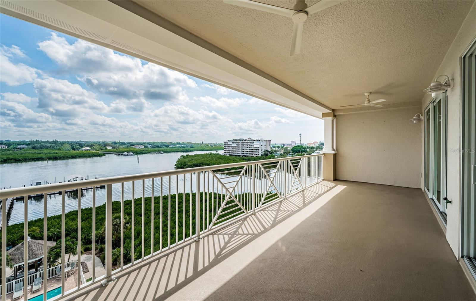 Step out onto your Huge Balcony overlooking the pool and Intracoastal!