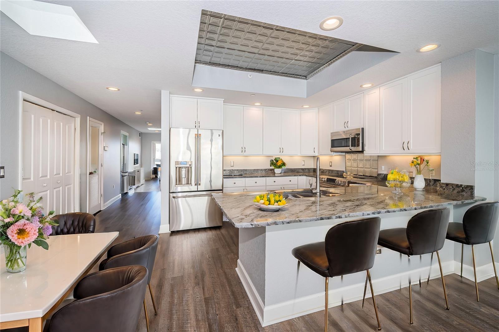 Virtually Staged Kitchen & Breakfast Bar with Dining area off to the side