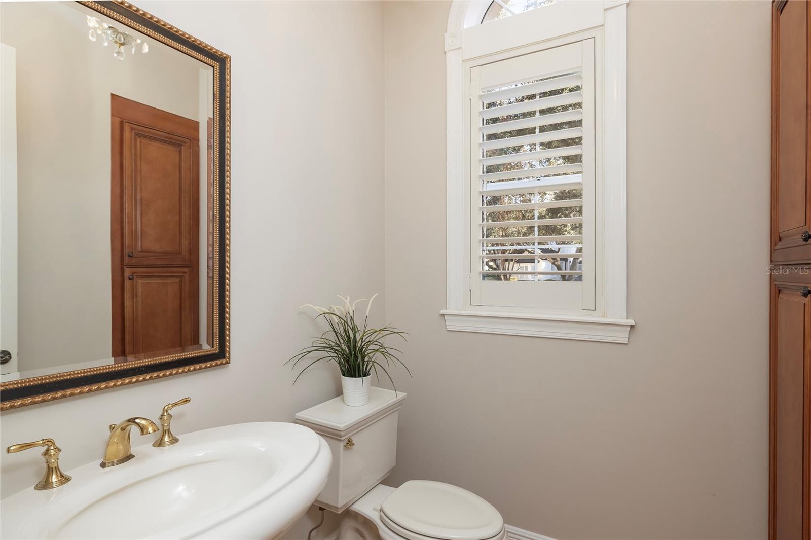 Powder bath off hallway just outside of the kitchen