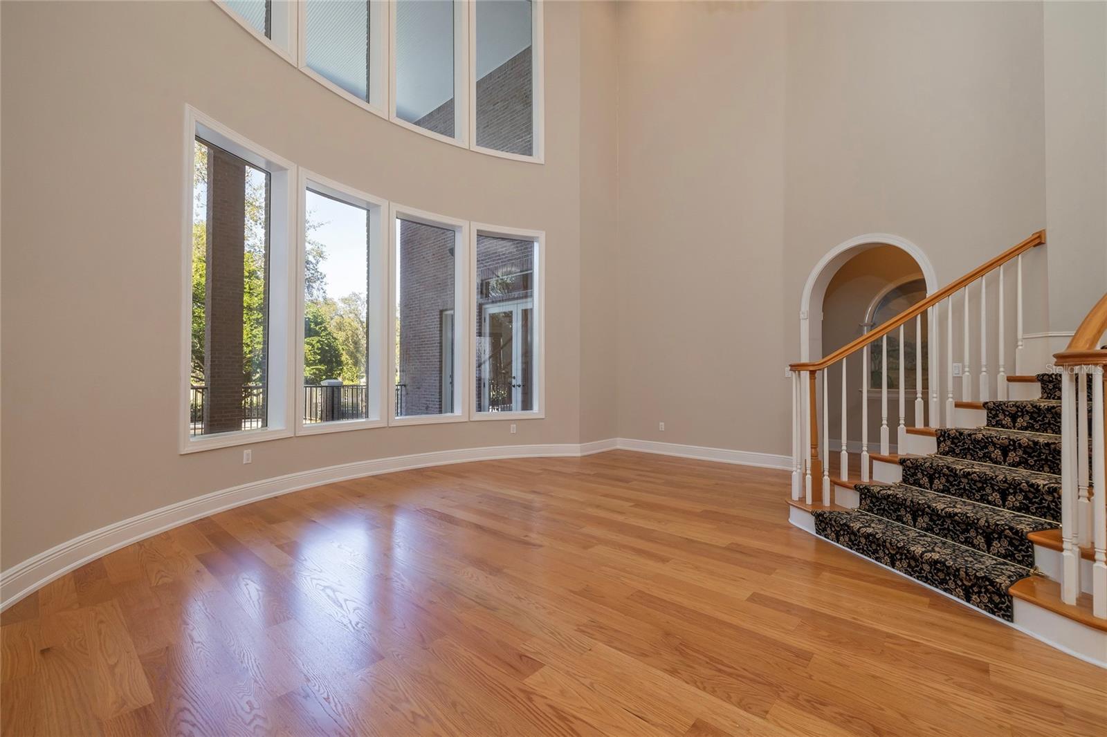 Doorway from living room leads to the primary suite and media/game room