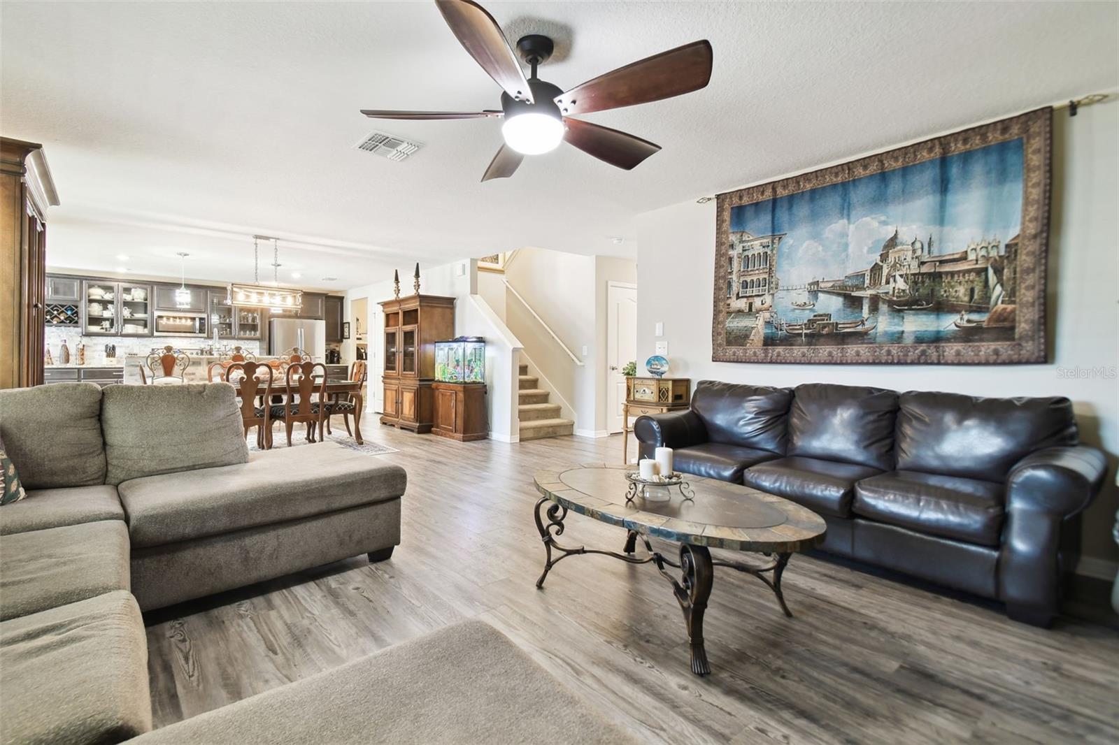 Large living room with ceiling fan