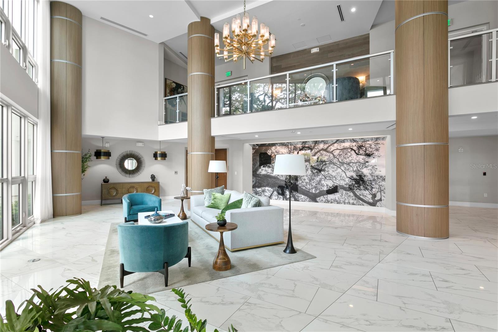 From the moment you arrive, you step into a well curated lobby with soaring ceilings and floor to ceiling windows overlooking a fabled grand oak with views extending to the waters of Hillsborough Bay.