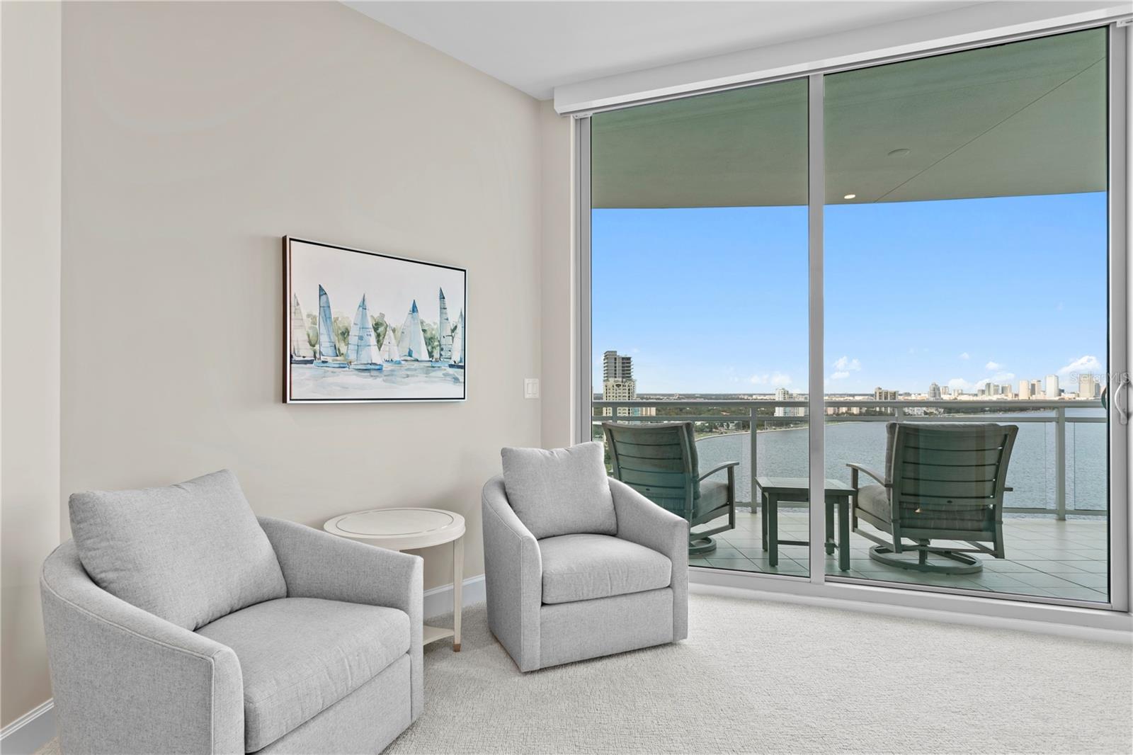 Beautiful sitting area in primary bedroom overlooks the Bay!