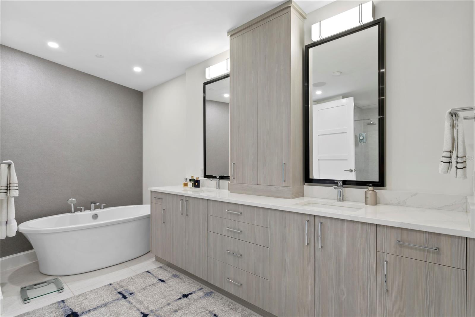 A well-appointed bath includes a deep soaking tub; split vanities with loads of storage and a generous walk-in shower