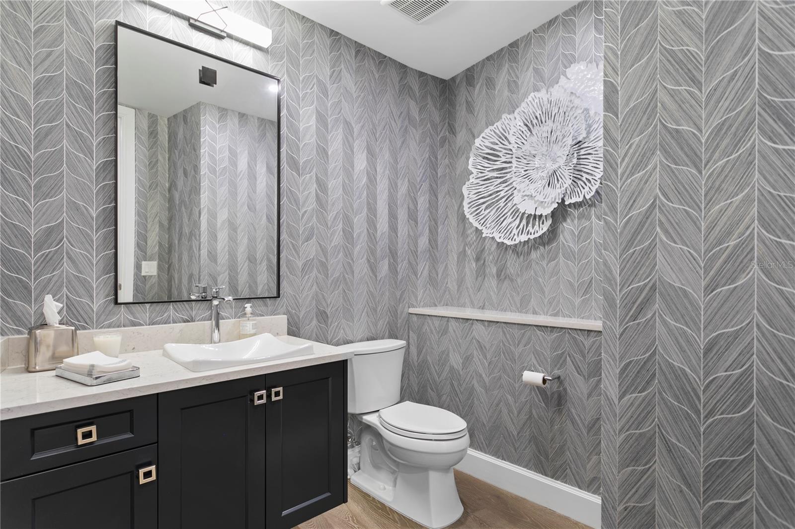 The guest bathroom with beautiful wallpaper