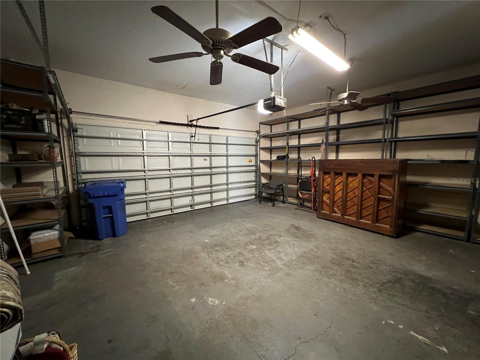 2 car garage. Metal shelving convey