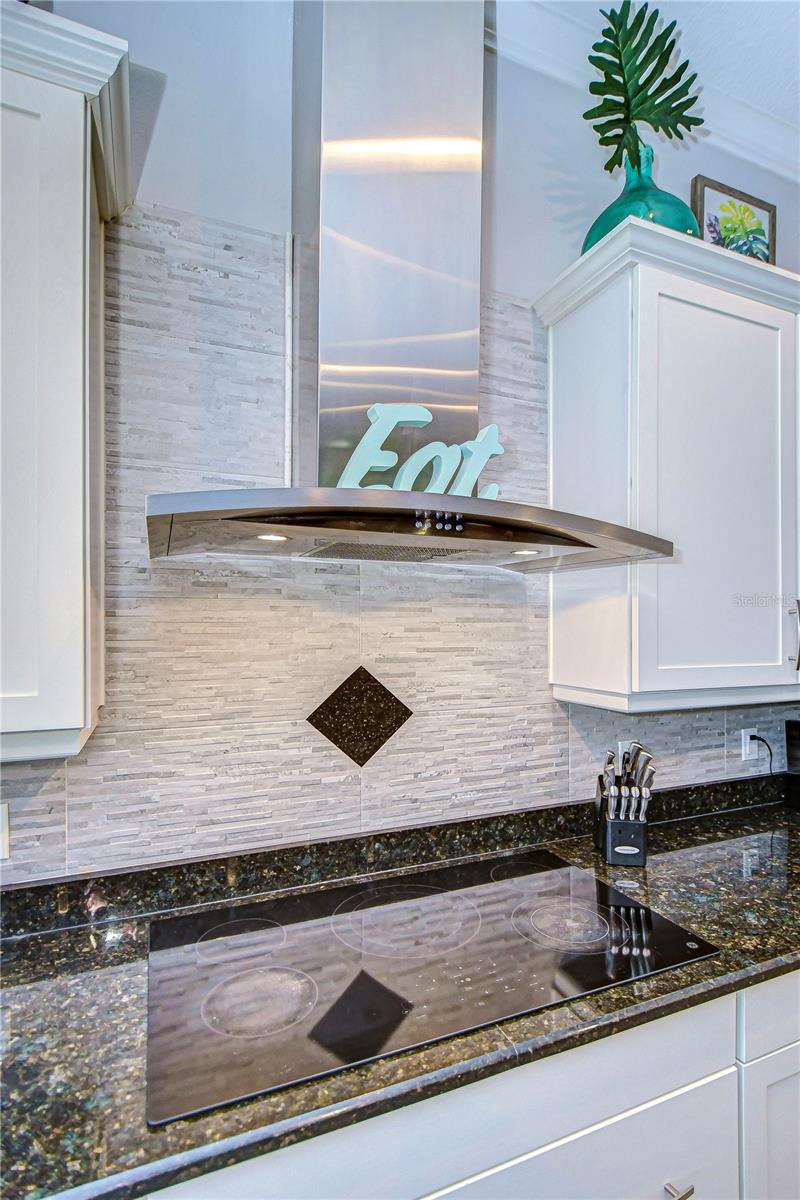 Custom kitchen backsplash and vented hood