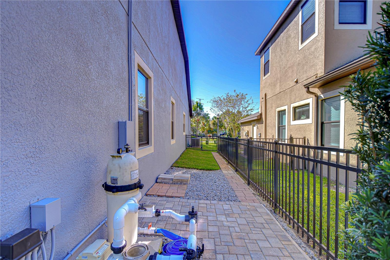 Sidewalk to front gate of fencing