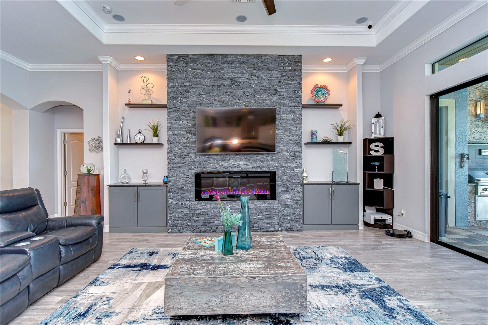 Custom fireplace stone wall and cabinetry