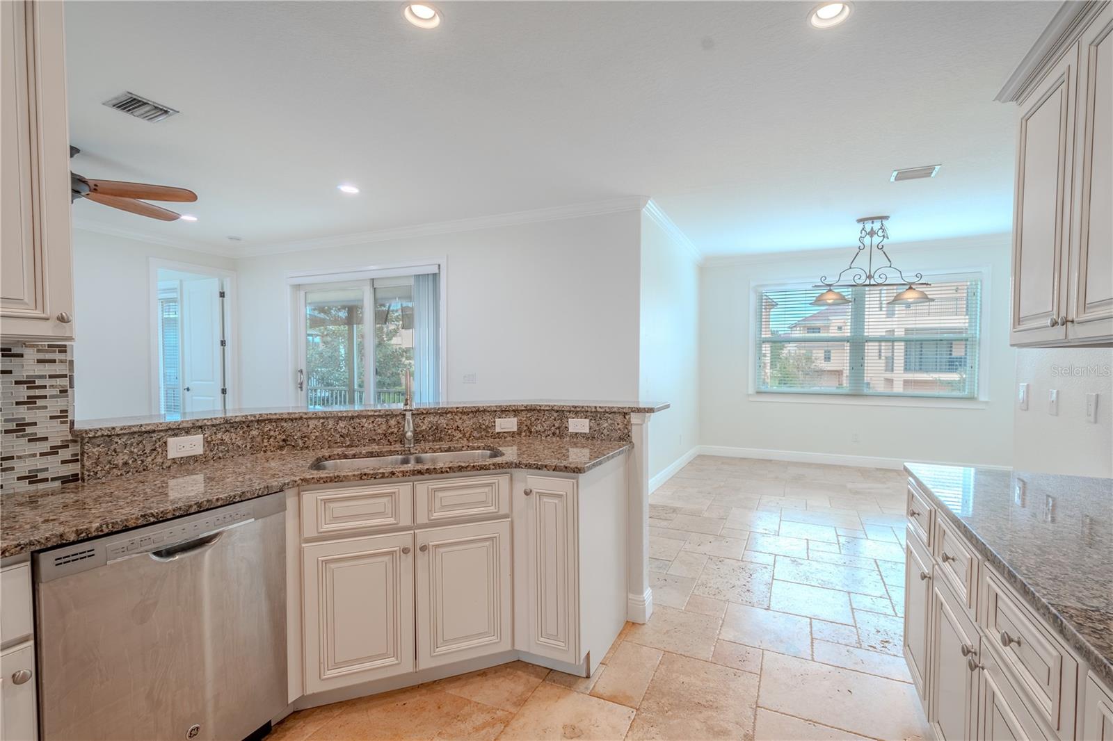 The kitchen has plenty of counter space, which is great for entertaining. There's also a large island with a breakfast bar, open to the dinette and living room.