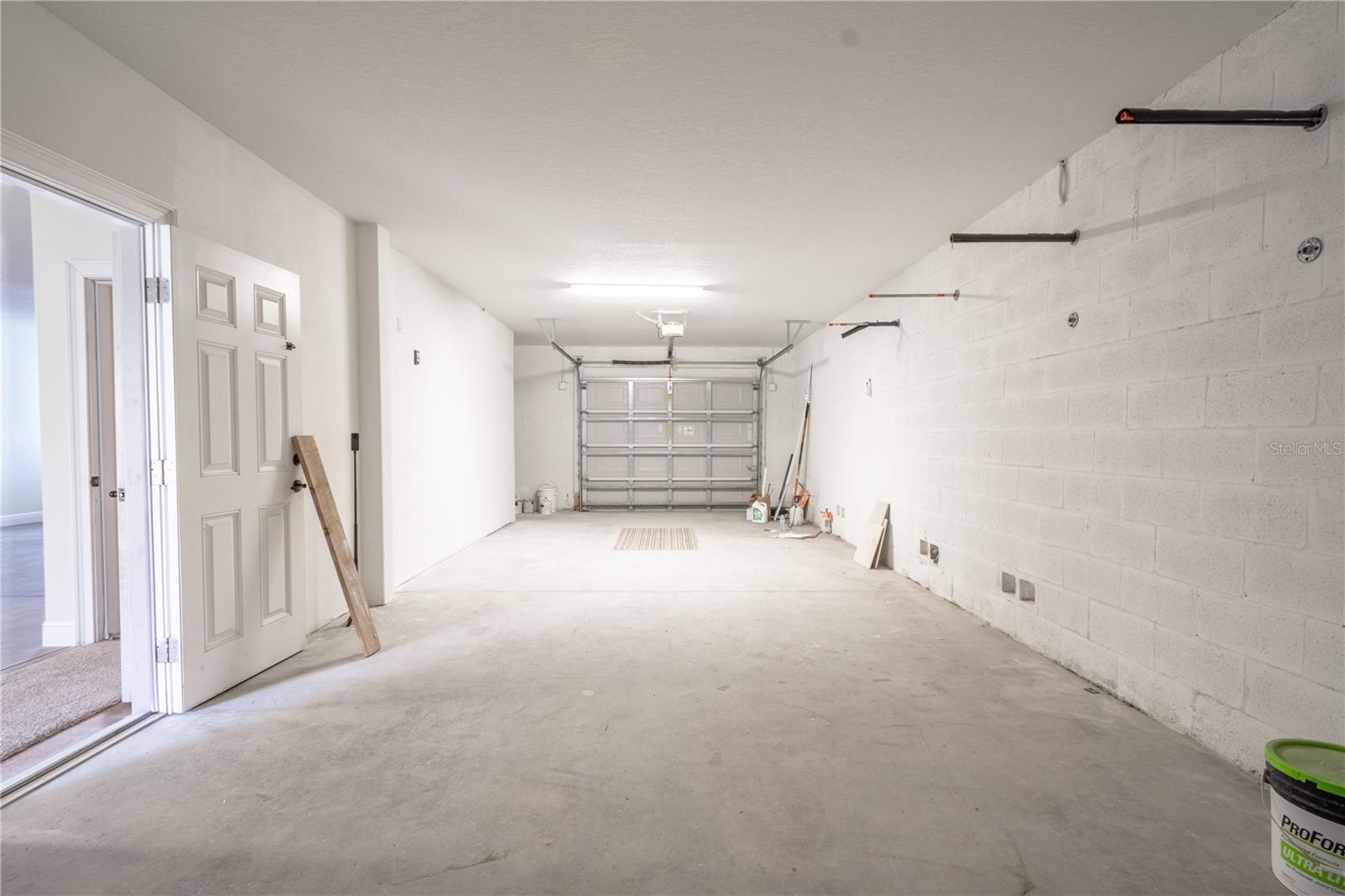 Split garages with electric door openers. This side can accommodate 2 cars.