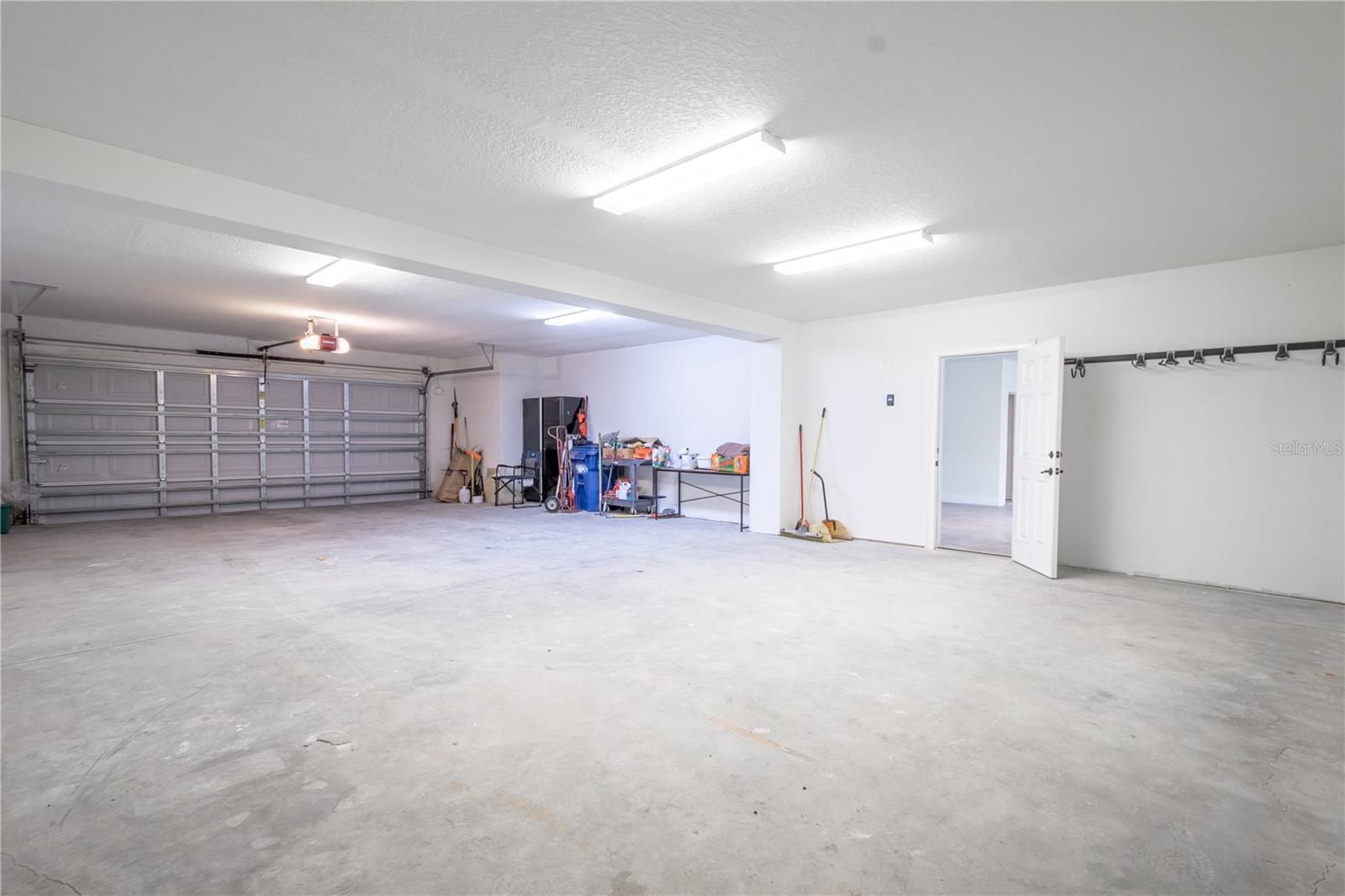 Split garages with electric door openers. This side can accommodate 4 cars.