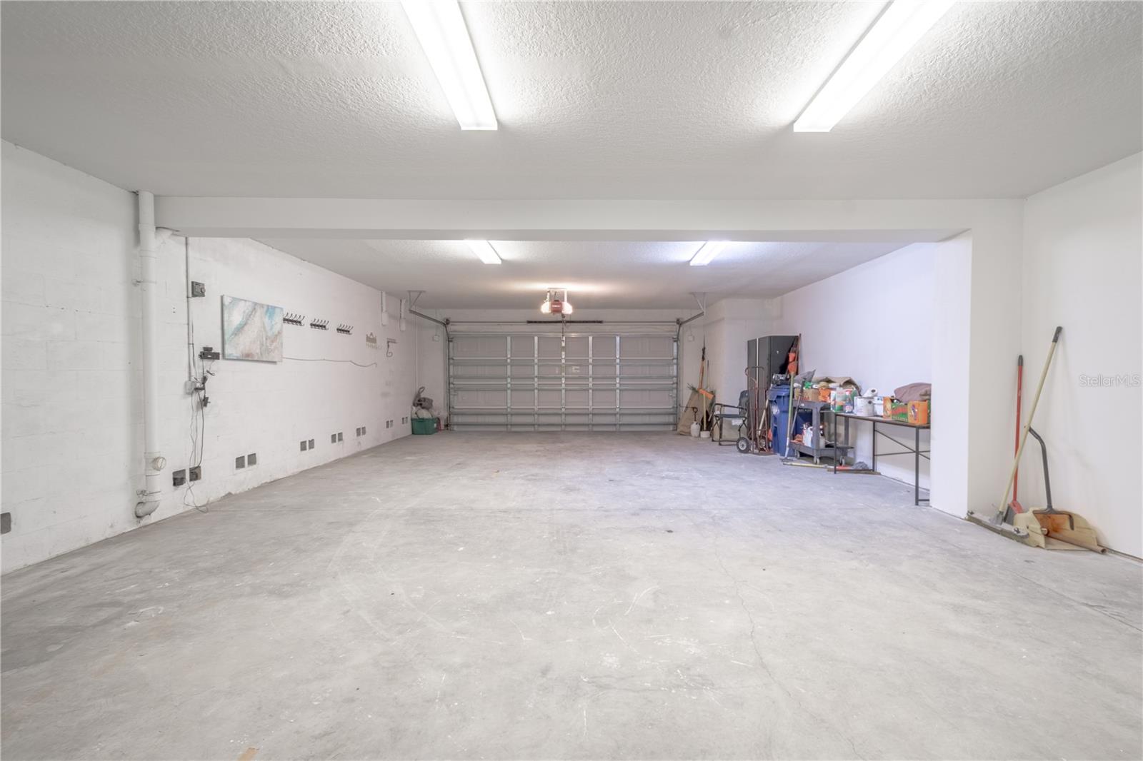 Split garages with electric door openers. This side can accommodate 4 cars.