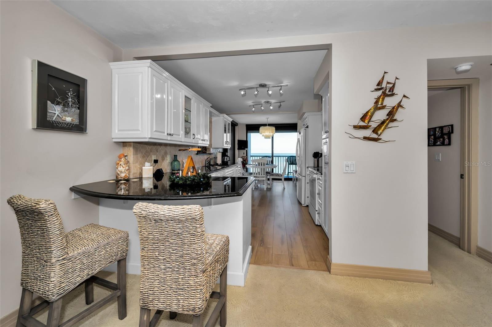 Large, Contemporary Kitchen with breakfast bar bar and Sunroom/Dining Area Adjacent