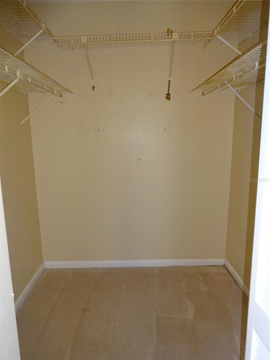 walk in closet in the primary bedroom