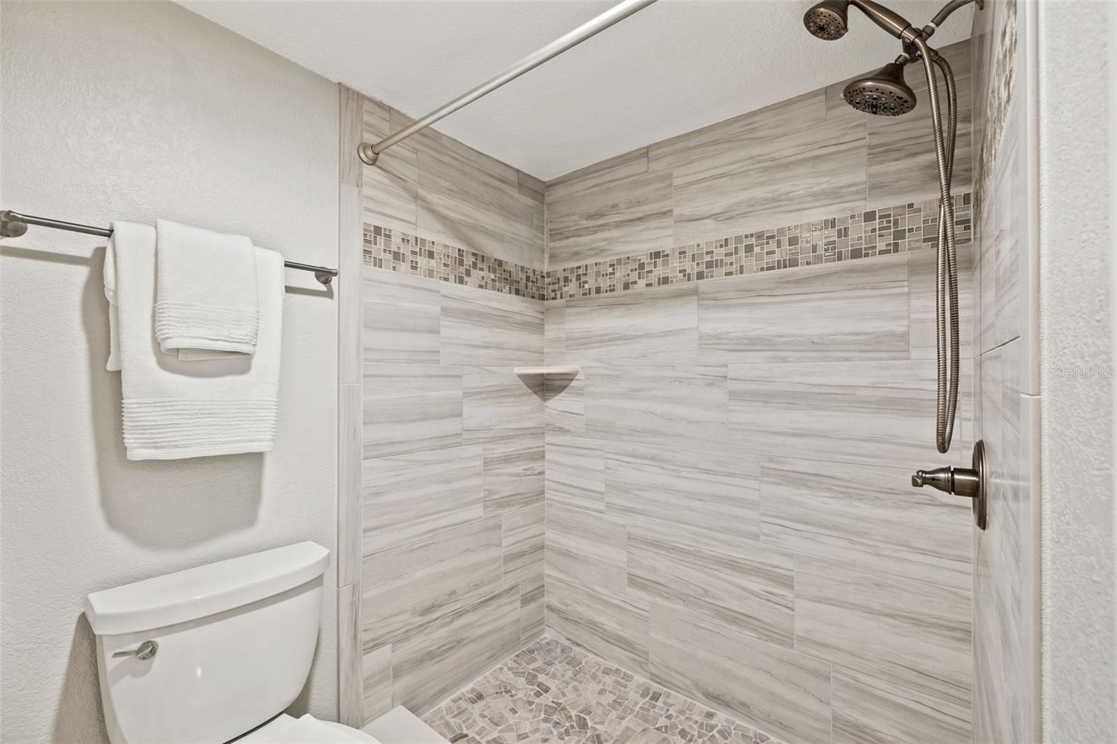 Primary Bathroom with Porcelain Tile Shower