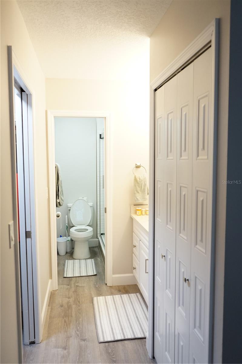 primary bath has linen closet and walk in closet